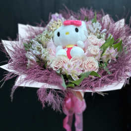 Pink rose bouquet with a Hello Kitty plush in the center