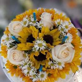 Round bouquet of yellow sunflowers, white roses, and small white daisies