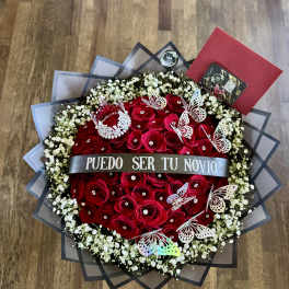 Red rose bouquet with baby’s breath, butterflies, and a silver ribbon