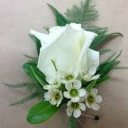 White calla lily boutonniere with small white accent flowers