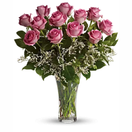 Pink roses arranged in a clear glass vase