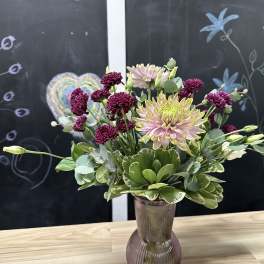 Mixed chrysanthemum bouquet in a ribbed glass vase