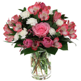 Pink and white mixed bouquet in a clear glass vase