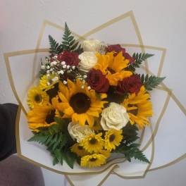 Bouquet of sunflowers, red and white roses, and baby's breath