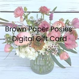 Pink and white mixed flower arrangement in a glass vase