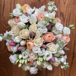 Bouquet of white and peach roses with pink tulips