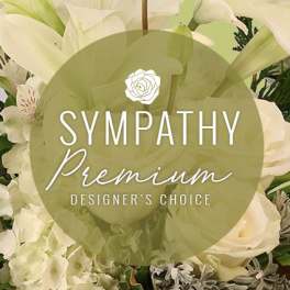 White sympathy floral arrangement with lilies and roses