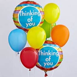 Cluster of colorful balloons, including two "thinking of you" balloons