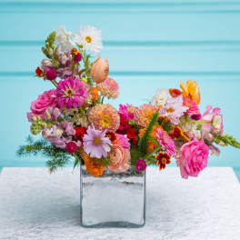 Colorful mixed bouquet in a clear glass vase