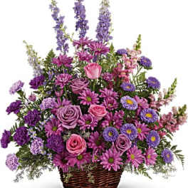 Purple and pink mixed flower basket with roses and daisies