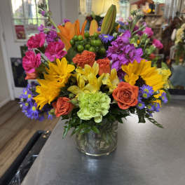 Colorful mixed bouquet in a clear glass vase