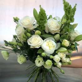Bouquet of white roses and green blooms with long stems