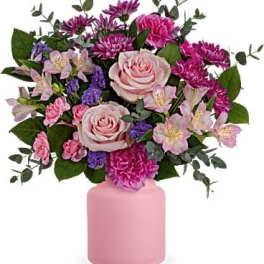 Pink and purple mixed bouquet in a pink vase
