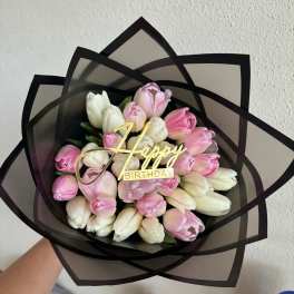 Bouquet of pink and white tulips with a Happy Birthday topper