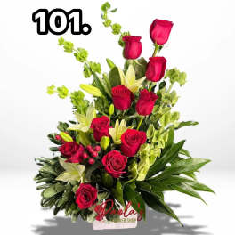 Bouquet of red roses and white lilies with greenery