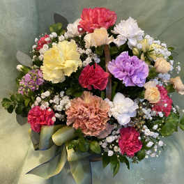 Colorful bouquet of carnations and baby's breath with a ribbon bow