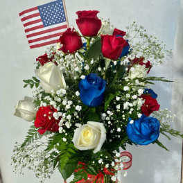 Bouquet of red, white, and blue roses with a small American flag