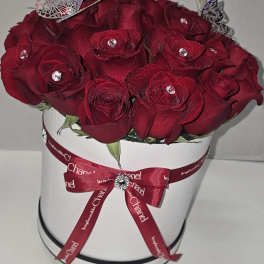Red rose bouquet in a white hat box with a ribbon bow
