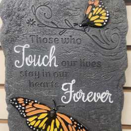 Decorative wall plaque with butterflies and a quote