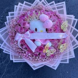 Pink rose bouquet with a Hello Kitty plush and birthday ribbon