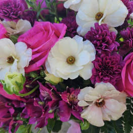 Bouquet of pink and white flowers with purple blooms