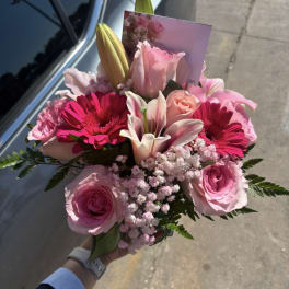 Pink bouquet with roses, lilies, and bright gerbera daisies