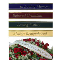 Red rose funeral arrangement with memorial ribbon