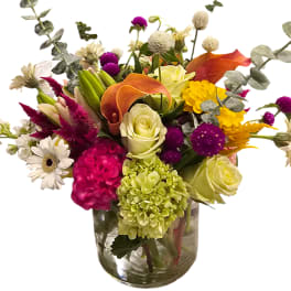 Colorful mixed bouquet in a clear glass vase