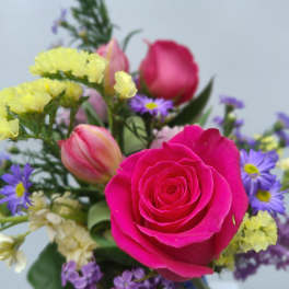 Pink rose bouquet with purple and yellow filler flowers