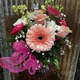 Pink gerbera bouquet with roses and white daisies in a vase