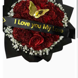 Red rose bouquet with a gold butterfly and a black ribbon reading I Love you My Love