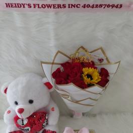 12 roses ,a  sunflowers, a beautiful teddy bear, and chocolates.