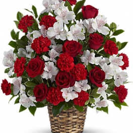 Red roses and white flowers in a woven basket