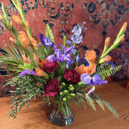 Colorful mixed bouquet in a clear glass vase