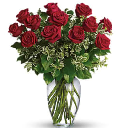 Bouquet of red roses in a clear glass vase