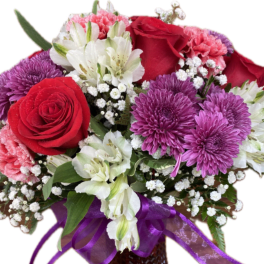 Bouquet of red roses, purple chrysanthemums, and pink carnations in a basket