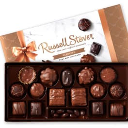 Box of assorted chocolates with a ribboned lid