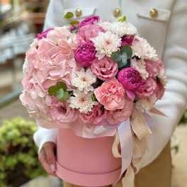 Pink and white bouquet in a pink hat box with ribbon