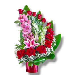 Red roses and pink orchids in a red vase