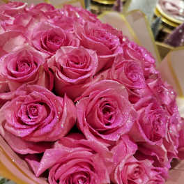 Bouquet of bright pink roses with glittery petals