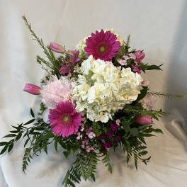 Pink gerberas and white hydrangeas in a mixed bouquet
