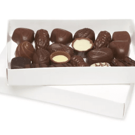 Box of assorted chocolates in a white tray