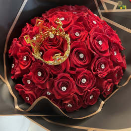 Bouquet of red roses with a gold crown decoration