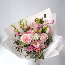 Pink and white bouquet with roses and calla lilies in paper wrap