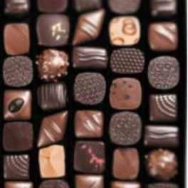 Assorted chocolates in a box with varied square pieces