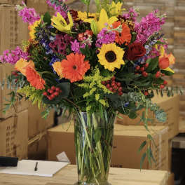 Colorful mixed bouquet in a clear glass vase