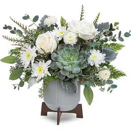 White roses and daisies in a gray vase with a succulent centerpiece