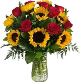 Bouquet of red roses and yellow sunflowers in a glass vase