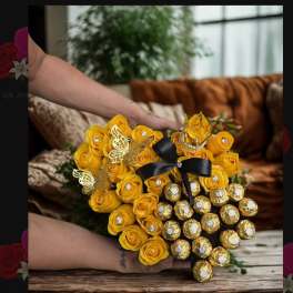 Yellow rose bouquet with Ferrero Rocher chocolates and a black ribbon