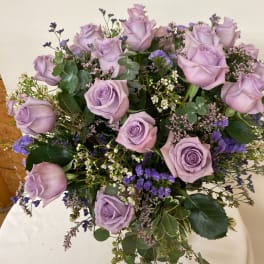 Bouquet of lavender roses with purple filler flowers